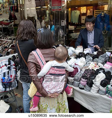 Women out for shopping in a market, Busan, Yeongnam, South Korea View Large Photo Image Stock Photography - Women out for shopping in a market, Busan, Yeongnam, South Korea. Fotosearch