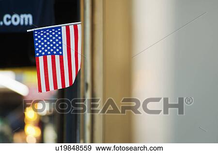 American flag on building View Large Photo Image Stock Photo - American flag on building. Fotosearch