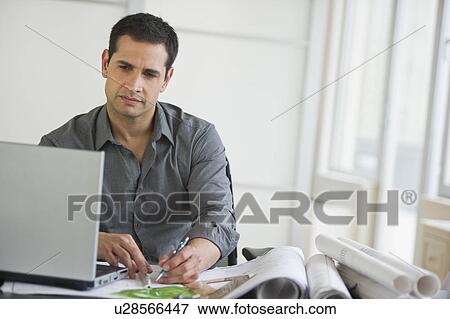 Stock Photo - Architect using laptop. Fotosearch