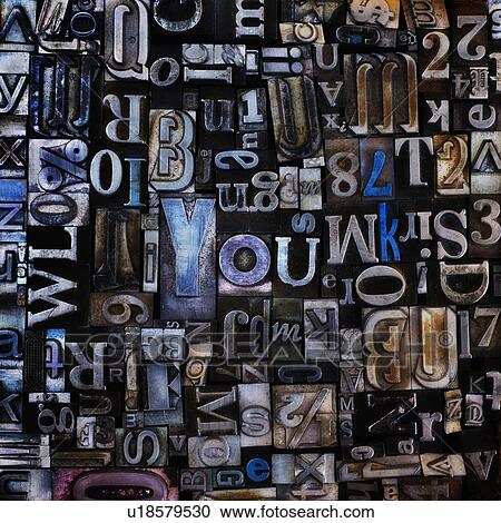 Stock Image - Assortment of printing blocks with word YOU in the middle of picture. Fotosearch
