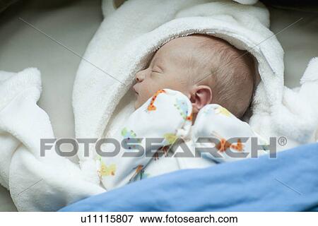 Stock Photo - Baby boy (0-1 months) sleeping. Fotosearch