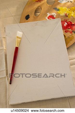 Picture - Blank artist's canvas, palette and paintbrush. Fotosearch