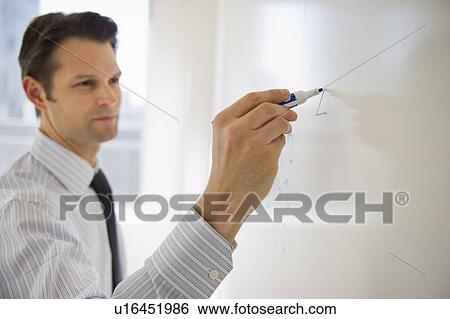 Businessman writing on whiteboard View Large Photo Image Stock Photograph - Businessman writing on whiteboard. Fotosearch