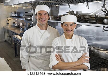 Stock Photo - Chef and cook in commercial kitchen. Fotosearch