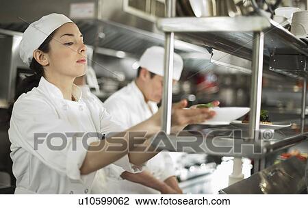 Chefs preparing food View Large Photo Image Stock Image - Chefs preparing food. Fotosearch
