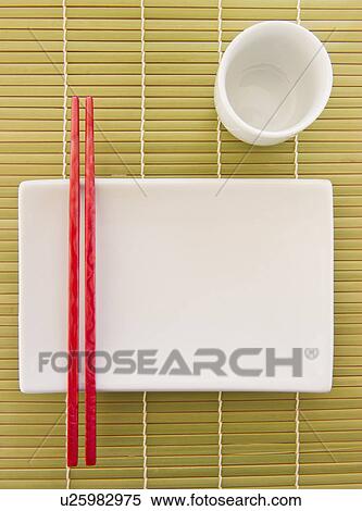 Chopsticks, plate and mug on bamboo mat View Large Photo Image Stock Photography - Chopsticks, plate and mug on bamboo mat. Fotosearch