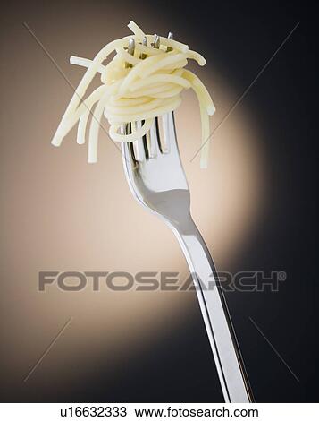 Close up of fork with spaghetti on black background View Large Photo Image Stock Image - Close up of fork with spaghetti on black background. Fotosearch