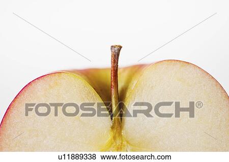 Close up of half of apple, studio shot View Large Photo Image Stock Photo - Close up of half of apple, studio shot. Fotosearch