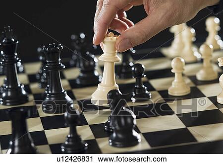 Close-up of man's hand playing chess View Large Photo Image Stock Image - Close-up of man's hand playing chess. Fotosearch