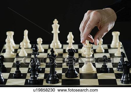 Close-up of man's hand playing chess View Large Photo Image Stock Image - Close-up of man's hand playing chess. Fotosearch