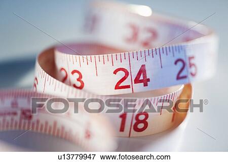 Close-up of measure tape, studio shot View Large Photo Image Stock Photo - Close-up of measure tape, studio shot. Fotosearch