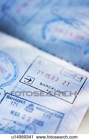 Stock Image - Close up of page from passport with stamps. Fotosearch