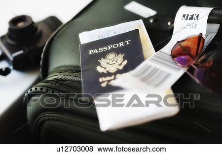 Stock Photo - Close up of passport and travel accessories. Fotosearch