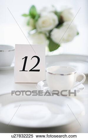 Stock Photography - Close up of place setting with number 12. Fotosearch