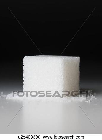 Stock Image - Close up of sugar cube. Fotosearch