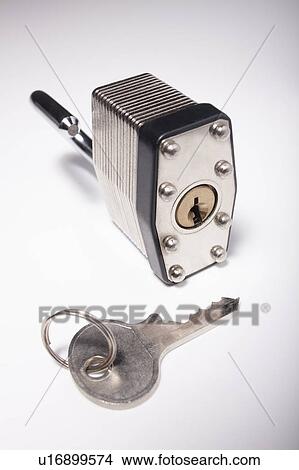 Close-up studio shot of silver padlock and key View Large Photo Image Picture - Close-up studio shot of silver padlock and key. Fotosearch