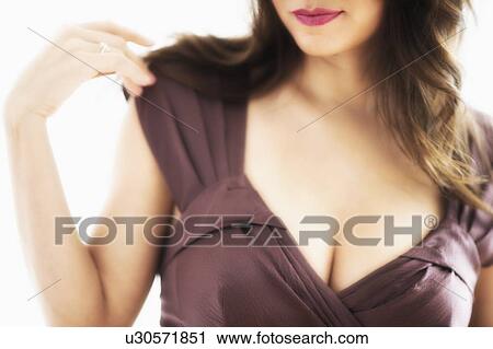 Close-up view of young woman's cleavage View Large Photo Image Stock Image - Close-up view of young woman's cleavage. Fotosearch