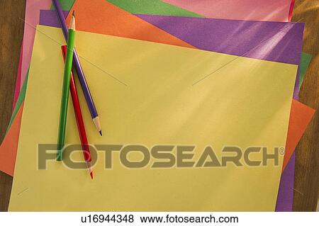 Colored pencils on blank colored paper View Large Photo Image Stock Photo - Colored pencils on blank colored paper. Fotosearch