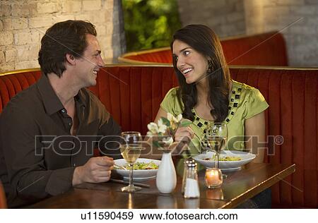 Stock Photo - Couple dining together in restaurant. Fotosearch