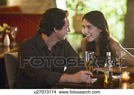 Picture - Couple drinking in restaurant. Fotosearch