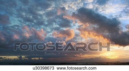 Dramatic sky with clouds at sunset View Large Photo Image Stock Image - Dramatic sky with clouds at sunset. Fotosearch