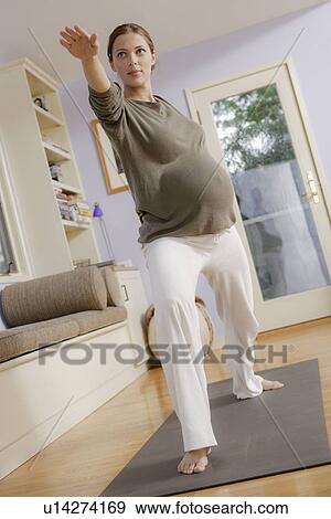 Expectant mother exercising View Large Photo Image Stock Photo - Expectant mother exercising. Fotosearch