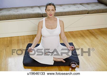 Expectant mother meditating View Large Photo Image Stock Image - Expectant mother meditating. Fotosearch