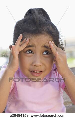 Stock Image - Girl (4-5) with headache. Fotosearch
