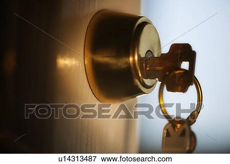 Keys hanging from front door View Large Photo Image Stock Photo - Keys hanging from front door. Fotosearch