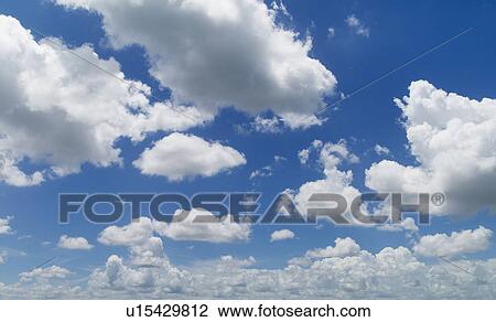 Magnificent cloudscape against blue sky View Large Photo Image Stock Image - Magnificent cloudscape against blue sky. Fotosearch