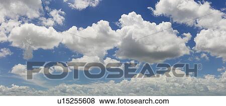 Magnificent cloudscape against blue sky View Large Photo Image Stock Photo - Magnificent cloudscape against blue sky. Fotosearch