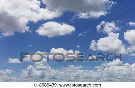 Magnificent cloudscape against blue sky View Large Photo Image Stock Photo - Magnificent cloudscape against blue sky. Fotosearch