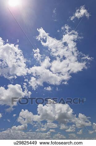 Magnificent cloudscape against blue sky View Large Photo Image Stock Photo - Magnificent cloudscape against blue sky. Fotosearch