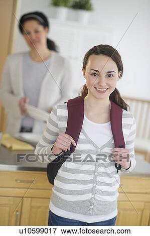 Stock Photo - Mother and teenage daughter (14-15). Fotosearch