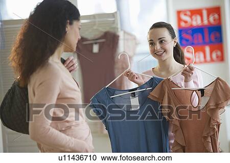 Mother with teenage girl (14-15) shopping View Large Photo Image Stock Image - Mother with teenage girl (14-15) shopping. Fotosearch