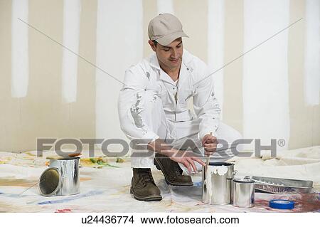 Picture - Painter opening paint can. Fotosearch