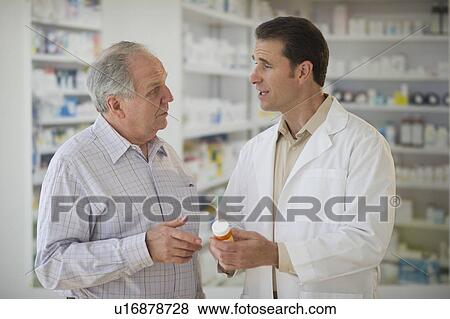 Pharmacist explaining use of medicine to patient View Large Photo Image Stock Photo - Pharmacist explaining use of medicine to patient. Fotosearch