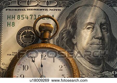 Pocket watch on one hundred dollar bill, studio shot View Large Photo Image Stock Photo - Pocket watch on one hundred dollar bill, studio shot. Fotosearch
