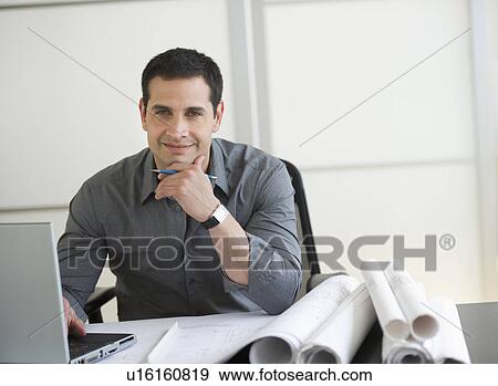 Stock Photo - Portrait of architect using laptop. Fotosearch