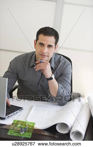 Stock Photo - Portrait of architect using laptop. Fotosearch