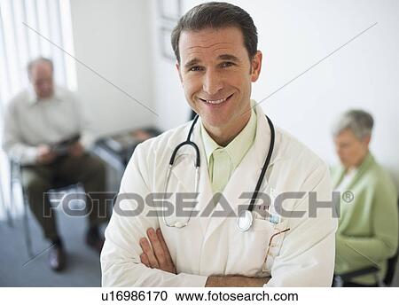 Portrait of doctor, senior couple in the background View Large Photo Image Stock Image - Portrait of doctor, senior couple in the background. Fotosearch