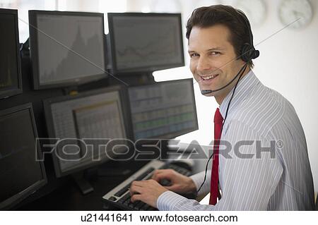 Portrait of financial worker analyzing data displayed on computer screen View Large Photo Image Stock Image - Portrait of financial worker analyzing data displayed on computer screen. Fotosearch