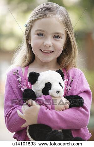 Portrait of girl (4-5) holding toy panda View Large Photo Image Stock Image - Portrait of girl (4-5) holding toy panda. Fotosearch