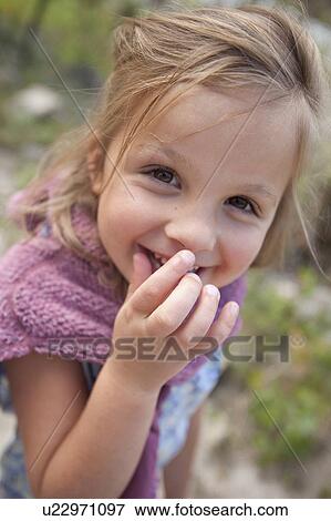 Stock Photo - Portrait of girl (4-5) smiling. Fotosearch