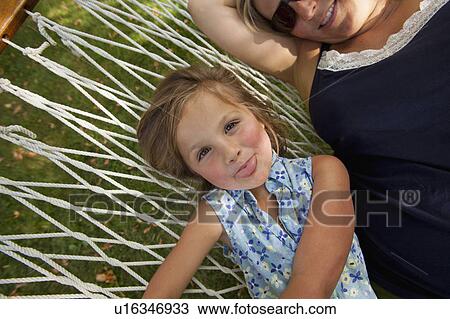 Portrait of girl (4-5) with mother in hammock View Large Photo Image Stock Image - Portrait of girl (4-5) with mother in hammock. Fotosearch