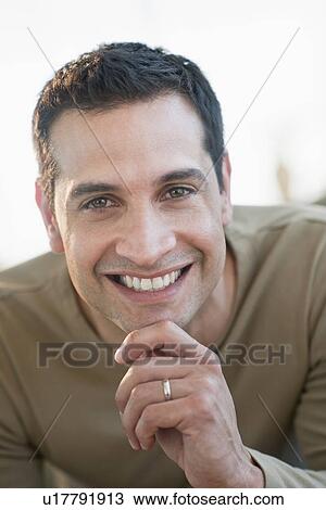 Stock Image - Portrait of mid adult man smiling. Fotosearch