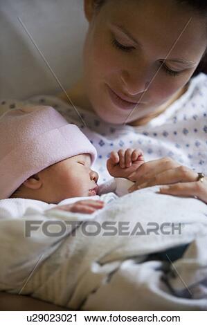 Portrait of newborn girl (0-1months) with mother View Large Photo Image Stock Image - Portrait of newborn girl (0-1months) with mother. Fotosearch