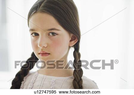 Portrait of sad girl (8-9) with braids View Large Photo Image Stock Photography - Portrait of sad girl (8-9) with braids. Fotosearch