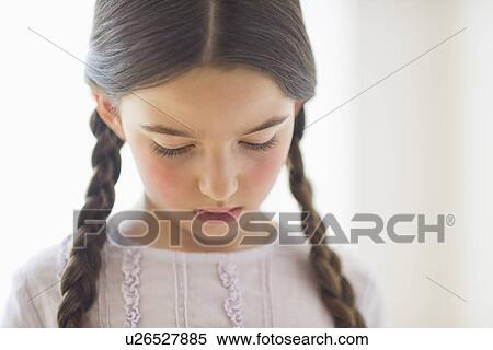 Portrait of sad girl (8-9) with braids View Large Photo Image Stock Photography - Portrait of sad girl (8-9) with braids. Fotosearch
