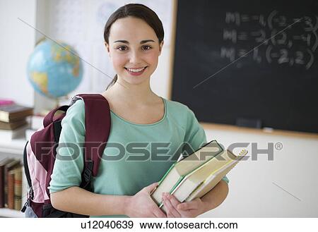 Stock Photo - Portrait of schoolgirl (14-15). Fotosearch